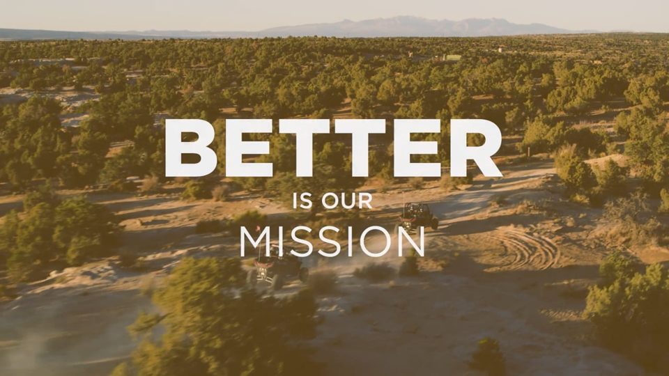 Title card from the Life. Better. Here. brand film: Better is our mission, over the Four Corners landscape.